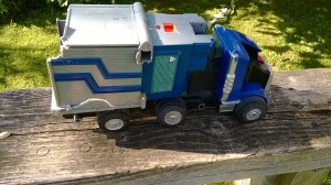 Lying in a clump of grass waving its wheels sadly.